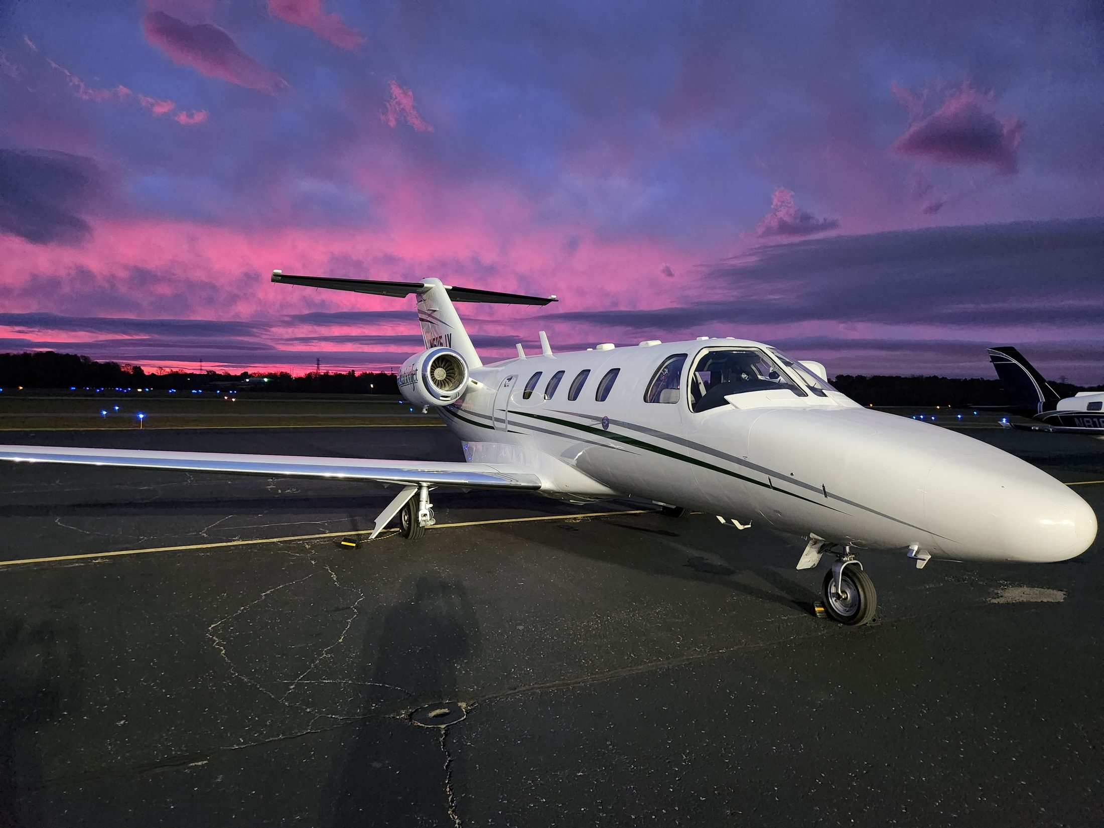 CitationJet on the ramp at dawn under a pink sky