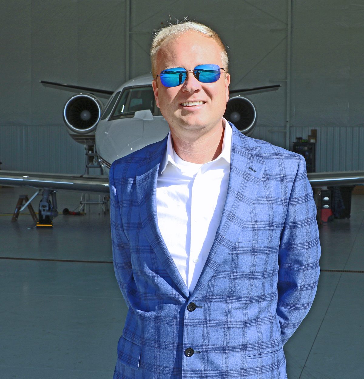 Corey Tomczak, founder of Gateway Jets, in the hangar in front of a Citation