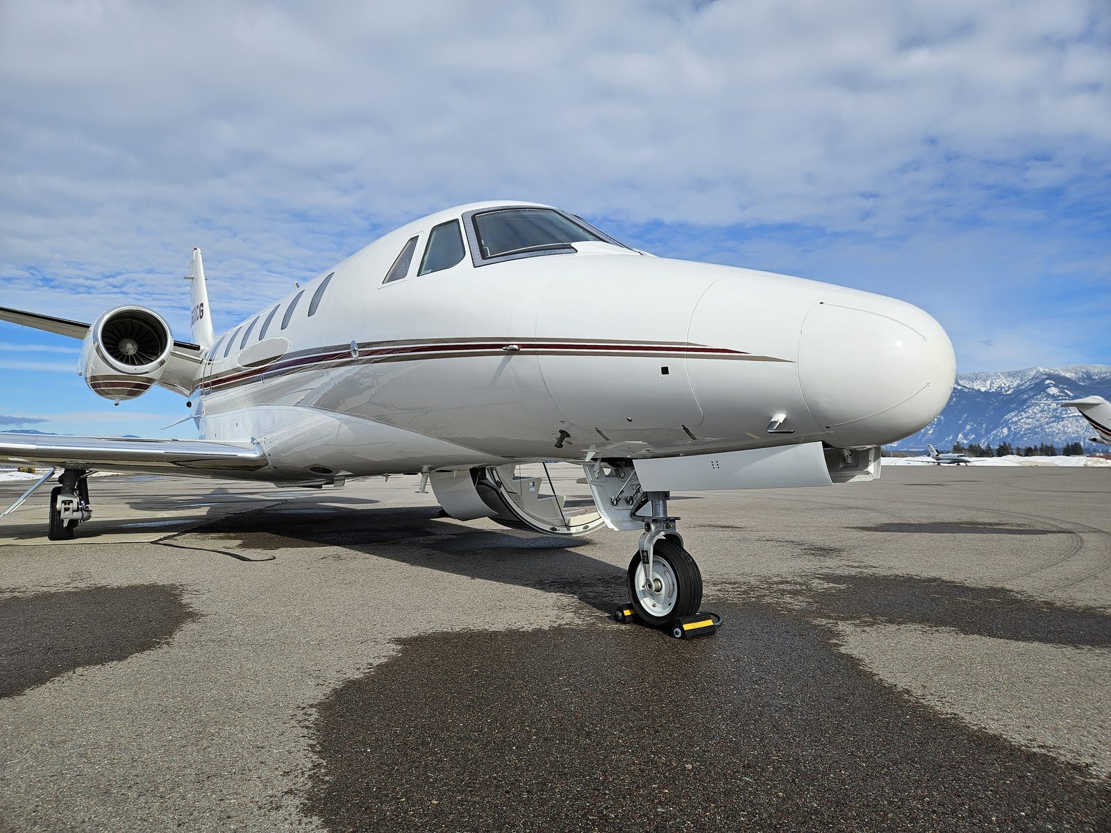 Citation Excel on the ramp with snow-covered mountains in the background