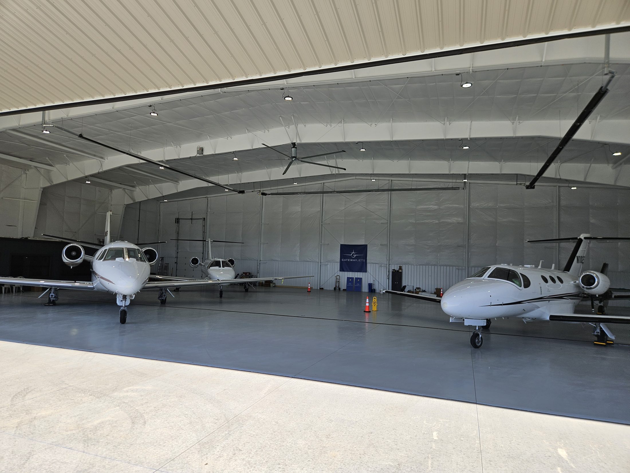 Three Citation jets inside the Gateway Jets corporate hangar at St. Louis Downtown Airport