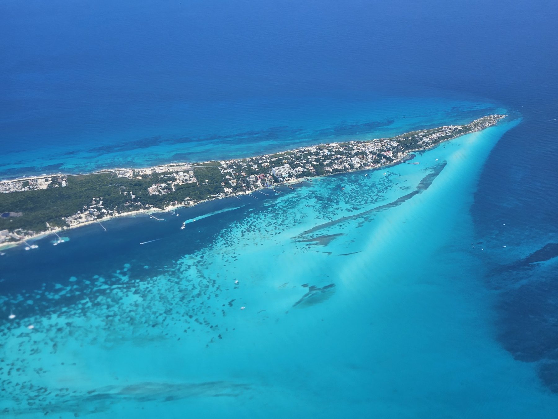 Aerial view of a turquoise Caribbean island photographed from a Citation at altitude